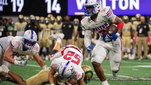 Walton's Makari Bodiford carries the ball down field during the Corky Kell and Dave Hunter Classic on August 19, 2023. (Jamie Spaar for the Atlanta Journal Constitution)