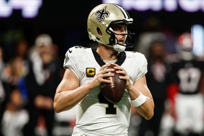 New Orleans Saints quarterback Derek Carr (4) works against the Atlanta Falcons during the second half of an NFL football game, Sunday, Sept. 29, 2024, in Atlanta. (AP Photo/Butch Dill)