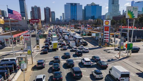 FILE - Commuters wait to drive through the Holland Tunnel into New York City during morning rush hour traffic in Jersey City, N.J.,, Wednesday, March 8, 2023. A study published Wednesday, May 22, 2024, says U.S. vehicles hit a record average age of 12.6 years in 2024 as people continue to hang on to their rides largely because new ones cost so much. (AP Photo/Ted Shaffrey, File)