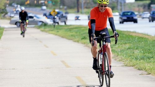 Bill Clineburg takes advantage of the sunshine and bikes on the Silver Comet Trail on Wednesday, March 25,  2020, at the Silver Comet Trail Connector in Smyrna, Georgia. Temperatures were warm throughout the metro Atlanta area reaching a high of 72 degrees, according to WSB-TV Meteorologist Brian Monahan. (Christina Matacotta, for The Atlanta Journal-Constitution)