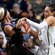 Minnesota Lynx forward Napheesa Collier pressures Connecticut Sun guard DiJonai Carrington, left, during the first half of a WNBA basketball semifinal game, Friday, Oct. 4, 2024, in Uncasville, Conn. (AP Photo/Jessica Hill)