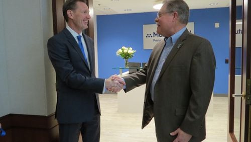 Peachtree Corners Mayor Mike Mason (right) after the ribbon-cutting congratulating Jeffrey Bulvin, General Agent of MassMutual Perimeter on their relocation to the city. (Courtesy Peachtree Corners)