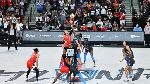 Las Vegas Aces center A'ja Wilson (22) and Atlanta Dream center Tina Charles (31) fight for jump ball during the first half at the Gateway Center Arena, Friday, July 12, 2024, in College Park. (Hyosub Shin / AJC)