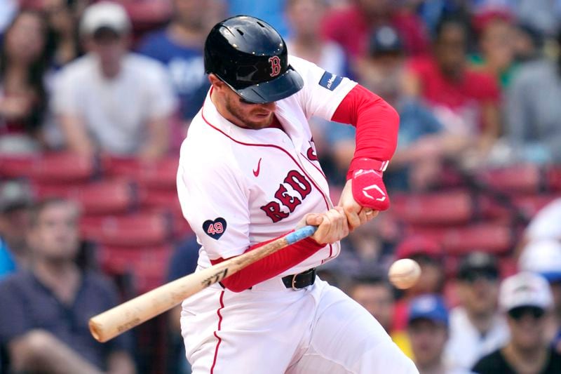 Boston Red Sox catcher Danny Jansen lines out during the resumption of the second inning of a baseball game against the Toronto Blue Jays, which was delayed due to rain in June, against the Toronto Blue Jays at Fenway Park, Monday, Aug. 26, 2024, in Boston. (AP Photo/Charles Krupa)