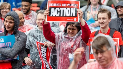 Attendees at the American Atheists National Convention in 2019 rallied in the rain in support of LGBTQ rights, abortion access, and full equality for atheists and other religious minorities.