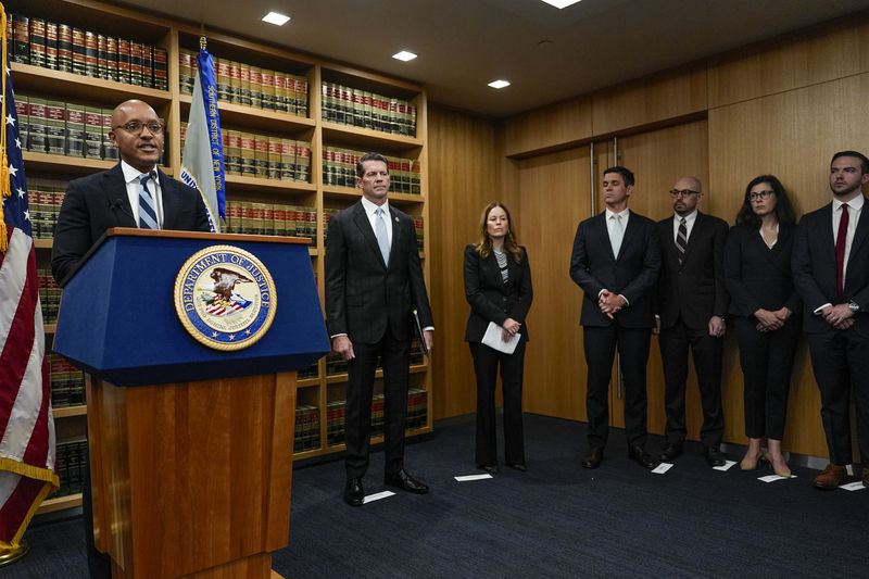 U.S. Attorney Damian Williams, left, speaks at a news conference detailing an indictment against New York City Mayor Eric Adams, Thursday, Sept. 26, 2024, in New York. (AP Photo/Julia Demaree Nikhinson)