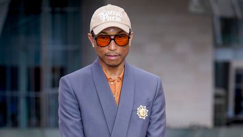 Pharrell Williams upon arrival at the Louis Vuitton Foundation on the eve of Paris Olympics opening ceremony, at the 2024 Summer Olympics, Thursday, July 25, 2024, in Paris, France. (AP Photo/Rebecca Blackwell)