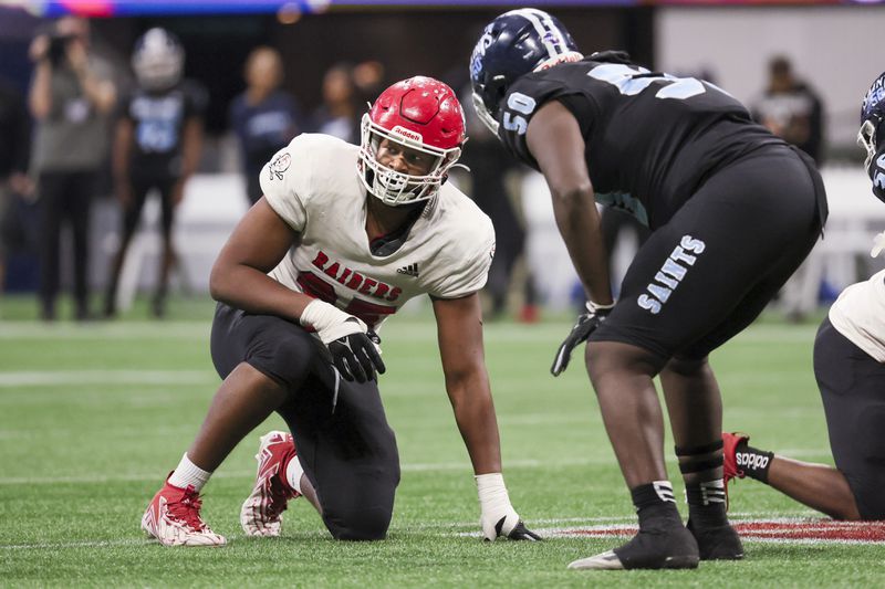 Savannah Christian defensive lineman Elijah Griffin (95) lines up for a play against Cedar Grove during the Class 3A GHSA State Championship game at Mercedes-Benz Stadium, Wednesday, December. 13, 2023, in Atlanta. (Jason Getz / Jason.Getz@ajc.com)