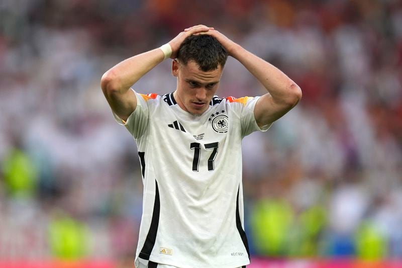 Germany's Florian Wirtz reacts at the end of a quarter final match between Germany and Spain at the Euro 2024 soccer tournament in Stuttgart, Germany, Friday, July 5, 2024. (AP Photo/Matthias Schrader)