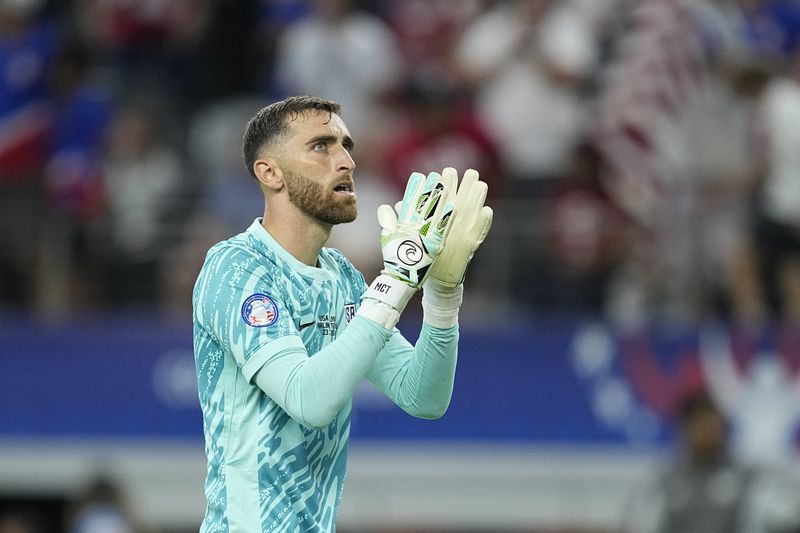Goalkeeper Matt Turner of the United States celebrates his team's 2-0 victory over Bolivia at the end of a Copa America Group C soccer match in Arlington, Texas, Sunday, June 23, 2024. (AP Photo/Tony Gutierrez)