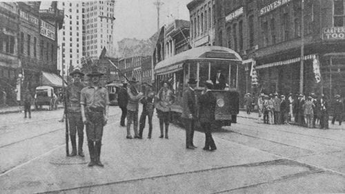 A photographer from Harper's Weekly took several pictures of state militia members guarding downtown streets in the days after the 1906 race massacre. This photo was taken at the intersection of Walton and Peachtree Streets, with the newly built Candler Building in the background. (Kenan Research Center at the Atlanta History Center / Used with permission)