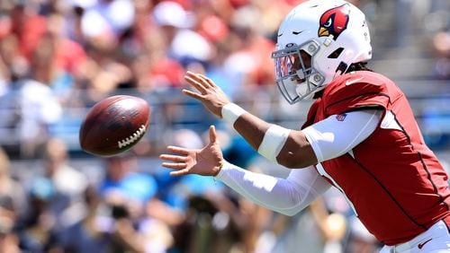 Kyler Murray (1) of the Arizona Cardinals receives the ball against the Jacksonville Jaguars at TIAA Bank Field on Sunday, September 26, 2021 in Jacksonville, Florida. (Sam Greenwood/Getty Images/TNS)