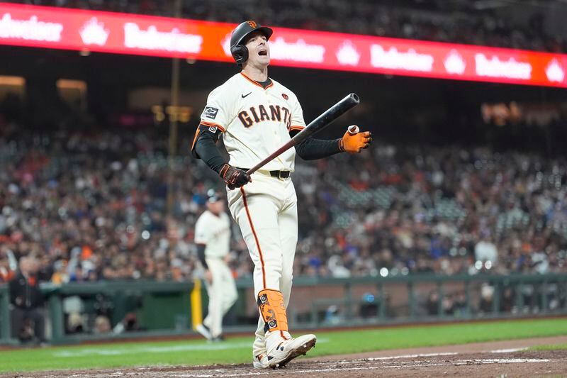 San Francisco Giants' Mike Yastrzemski reacts after striking out against the Atlanta Braves during the 10th inning of a baseball game in San Francisco, Monday, Aug. 12, 2024. (AP Photo/Jeff Chiu)