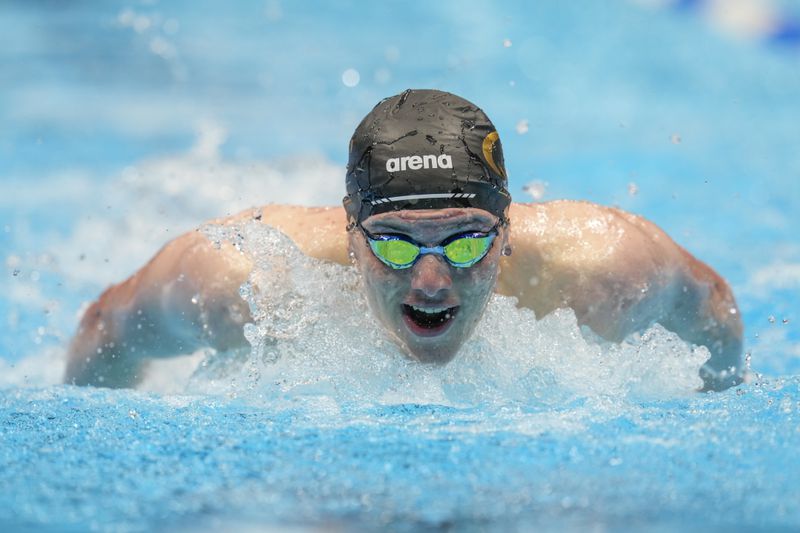Thomas Heilman swims during a Men's 200 butterfly preliminary heat Tuesday, June 18, 2024, at the US Swimming Olympic Trials in Indianapolis. (AP Photo/Darron Cummings)