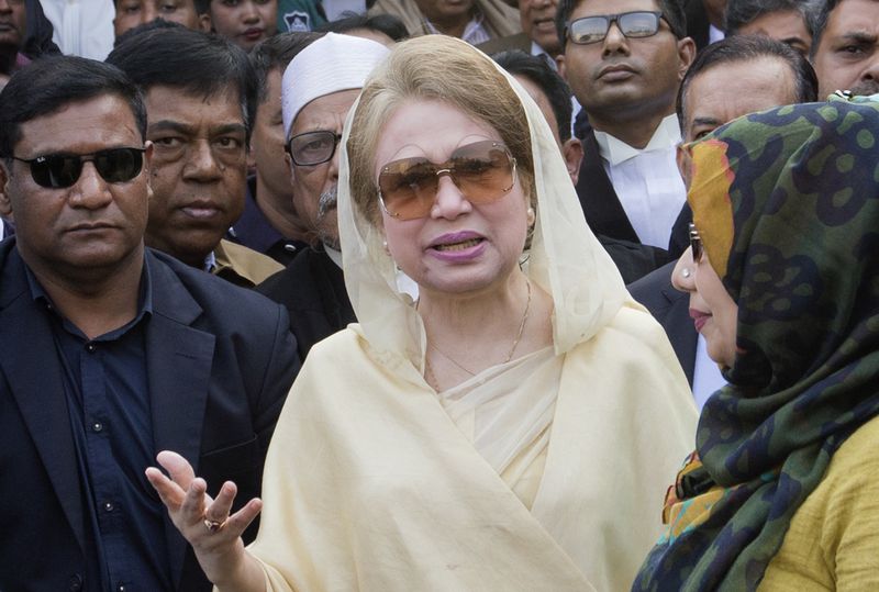 FILE- In this Dec. 28, 2017, file photo, Bangladesh's former prime minister and Bangladesh Nationalist Party (BNP) chairperson Khaleda Zia, center, leaves after a court appearance in Dhaka, Bangladesh. (AP Photo/A.M. Ahad, File)