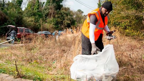 Lifelong Pleasant Hill neighborhood resident Antonio Williams picks up trash at the corner of Roosevelt Ave. and Willis Lane. Macon Mayor Lester Miller announced a new initiative to focus on data-driven neighborhood cleanups in Macon. (Photo Courtesy of Jason Vorhees/The Telegraph)