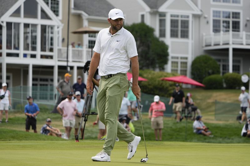 Scottie Scheffler walks on the 12th green during the second round of the Travelers Championship golf tournament at TPC River Highlands, Friday, June 21, 2024, in Cromwell, Conn. (AP Photo/Seth Wenig)