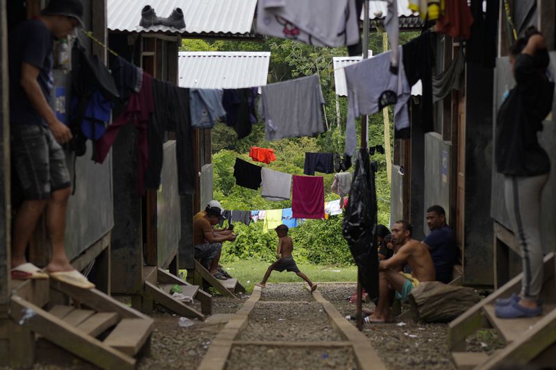 Migrants rest at a camp after treking across the Darien Gap from Colombia in hopes of reaching the U.S., in Lajas Blancas, Panama, Thursday, Sept. 26, 2024. (AP Photo/Matias Delacroix)