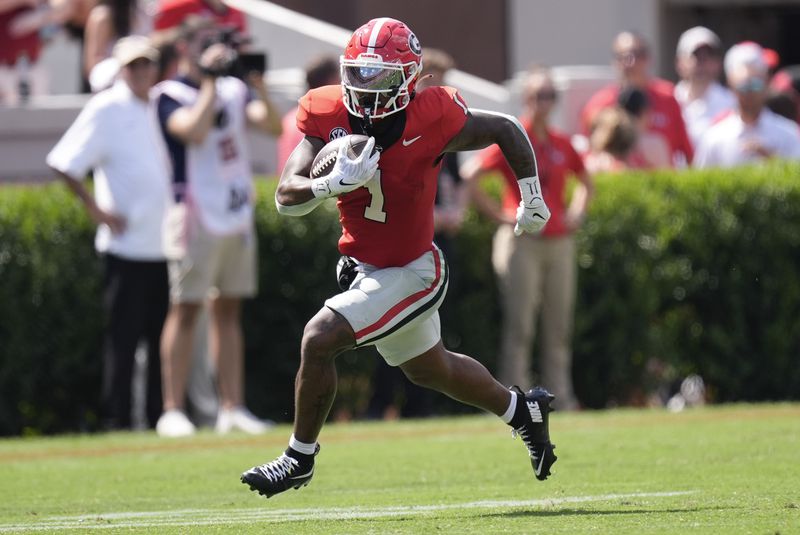 Georgia running back Trevor Etienne (1) runs for a big gain after a catch during the first half of an NCAA college football game against Tennessee Tech Saturday, Sept. 7, 2024, in Athens, Ga. (AP Photo/John Bazemore)