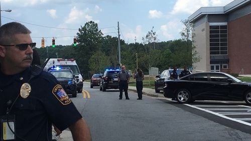 In a guest column, a former Cobb school board member and a high school student maintain an increased police presence in U.S. schools has not decreased school shootings. (AJC file photo)