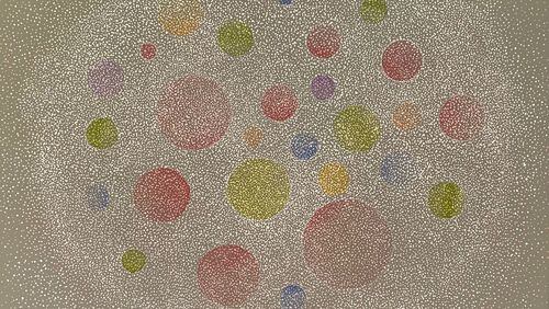Don Cooper's "Eyelid Movies (Phosphenes)," 2021, is composed of a series of delicately painted circles made up of pointillist dots floating in a soft-edged elliptical form which itself is made up of varying sizes of pale white dots with a muted light brown background.