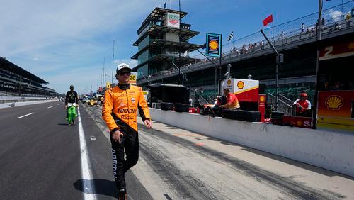 Pato O'Ward, of Mexico, walk down pit lane during a practice session for the Indianapolis 500 auto race at Indianapolis Motor Speedway, Monday, May 20, 2024, in Indianapolis. (AP Photo/Darron Cummings)
