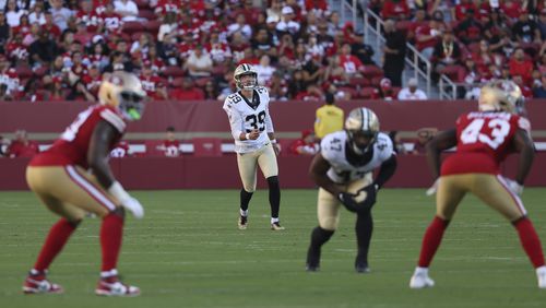 New Orleans Saints place kicker Charlie Smyth (39) watches his kickoff during the first half of a preseason NFL football game against the San Francisco 49ers in Santa Clara, Calif., Sunday, Aug. 18, 2024. (AP Photo/Jed Jacobsohn)