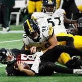 Atlanta Falcons quarterback Kirk Cousins (18) gets a sack in the game’s last play by Pittsburgh Steelers linebacker T.J. Watt (90) on Sunday, Sept. 8, at Mercedes-Benz Stadium in Atlanta. The Falcons lost 18-10. (Miguel Martinez/ AJC)