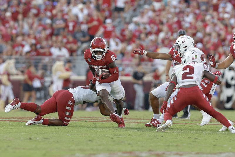 Oklahoma wide receiver Deion Burks (6) runs for a first down against Temple during the second quarter of an NCAA college football game Friday, Aug. 30, 2024, in Norman, Okla. (AP Photo/Alonzo Adams)