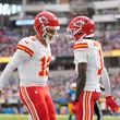 Kansas City Chiefs wide receiver Xavier Worthy, right, is celebrates after catching a 54-yard touchdown pass from teammate Patrick Mahomes, left, during the first half of an NFL football game against the Los Angeles Chargers Sunday, Sept. 29, 2024, in Inglewood, Calif. (AP Photo/Ashley Landis)