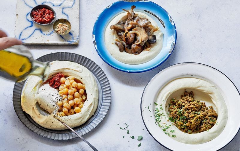 Perfectly Balanced Hummus can be served as is, with warm pita bread, garnished with whole chickpeas and herbs, or topped with spiced meat or sauteed mushrooms for a main dish. Excerpted from “Shuk” by Einat Admony and Janna Gur (Artisan Books, $35). Copyright © 2019. CONTRIBUTED BY QUENTIN BACON