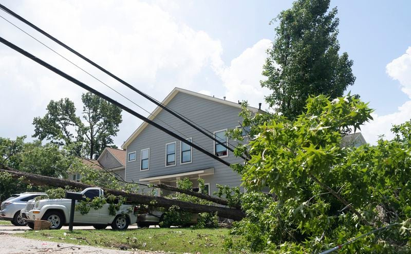 Hurricane Beryl's path left down power lines in Acres Homes neighborhood in Houston, on Wednesday, July 10, 2024. ( Elizabeth Conley/Houston Chronicle via AP)
