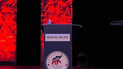 An image of Herschel Walker’s empty podium at the 9th District GOP debate in Gainesville. 