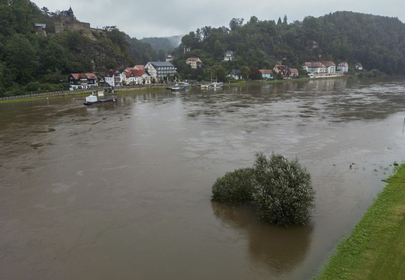 View of the river Elbe in flood, in Rathen, Germany, Monday Sept. 16, 2024. The water levels continue to rise in Saxony. (Jan Woitas/dpa via AP)