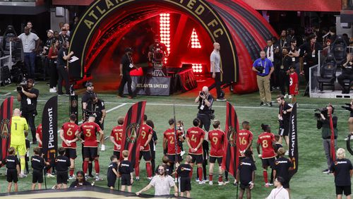 Atlanta United players line up for the national anthem before the soccer match against New York City F.C. at Mercedes-Benz Stadium on Wednesday, July 17, 2024.  (Miguel Martinez/ AJC)