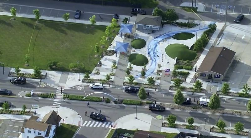 Police respond to the scene of a shooting at the Brooklands Plaza Splash Pad, Saturday, June 15, 2024, in Rochester Hills, Mich. The Oakland County Sheriff’s Office says there are “numerous wounded victims” after police were called for an active shooter. (WXYZ via AP)