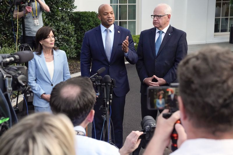 Maryland Gov. Wes Moore speaks to reporters after meeting with President Joe Biden, Wednesday, July 3, 2024, at the White House in Washington, as New York Gov. Kathy Hochul and Minnesota Gov. Tim Walz listen. (AP Photo/Jacquelyn Martin)