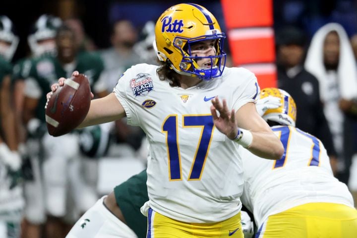 Pittsburgh Panthers quarterback Davis Beville (17) attempts a pass during the first half against the Michigan State Spartans in the Chick-fil-A Peach Bowl at Mercedes-Benz Stadium in Atlanta, Thursday, December 30, 2021. JASON GETZ FOR THE ATLANTA JOURNAL-CONSTITUTION