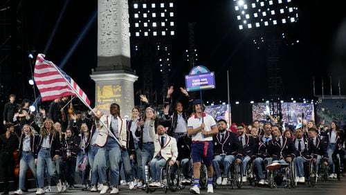 Members of the U.S delegation parade during the Opening Ceremony for the 2024 Paralympics, Wednesday, Aug. 28, 2024, on La Concorde plaza in Paris, France. (AP Photo/Christophe Ena)