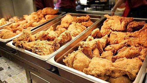 Chicken warms under the hot lights at the Bojangles restaurant on in College Park. The new Bojangles stores are part of a push to open 80 new locations in major Georgia cities.