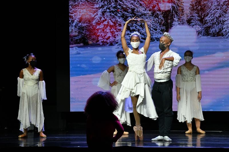 December 4, 2020 Alpharetta - Nena Gilreath (foreground), co-founder of Ballethnic Dance Company, instructs lead dancers Karla Tyson (center left) and Calvin Gentry (center right) during  Ballethnic’s Urban Nutcracker Experience which is being recorded at The Legacy Theater At Phase Family Center in Alpharetta on Friday, December 4, 2020. (Hyosub Shin / Hyosub.Shin@ajc.com)