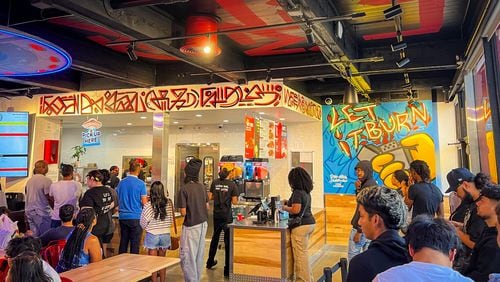 The Atlanta-themed dining room at Dave's Hot Chicken in Conyers was packed early on a Sunday evening. (Henri Hollis/henri.hollis@ajc.com)