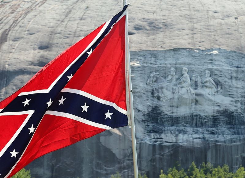Confederate flags were waved at the base of Stone Mountain after a pro-Confederate flag rally in August 2015 at Stone Mountain Park in Stone Mountain, Georgia. 