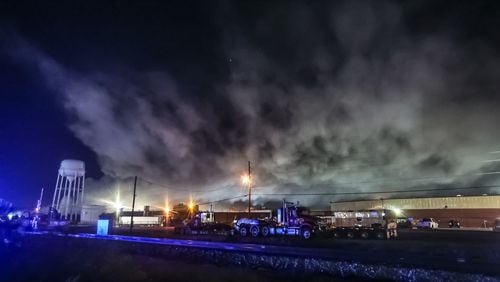 A plume from the chemical plant fire in Conyers continues to billow early Thursday morning.