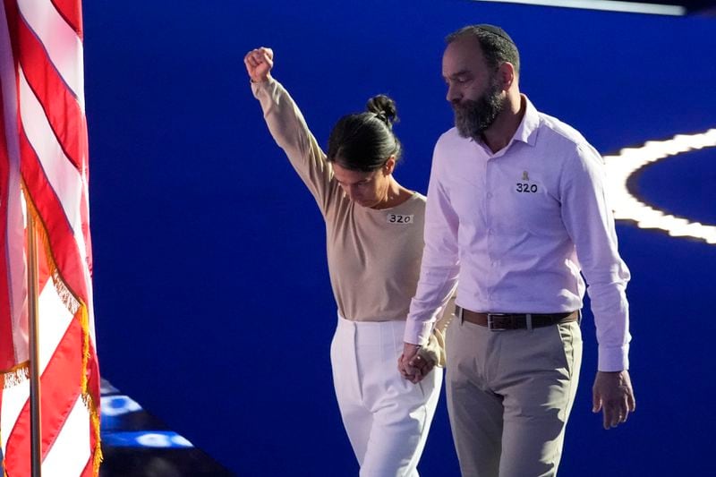 Jon Polin and Rachel Goldberg, parents of hostage Hersh Goldberg-Polin walk off the stage after speaking during the Democratic National Convention Wednesday, Aug. 21, 2024, in Chicago. (AP Photo/Matt Rourke)