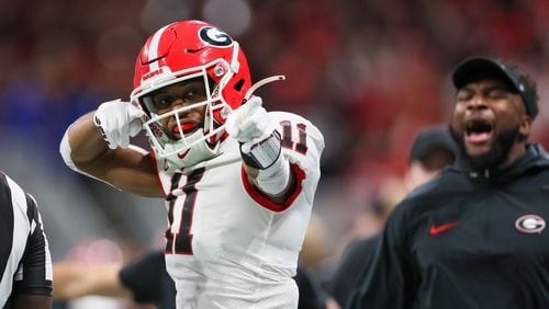 Georgia Bulldogs wide receiver Arian Smith (11) celebrates a catch against the Alabama Crimson Tide during the second half of the SEC Championship football game at the Mercedes-Benz Stadium in Atlanta, on Saturday, December 2, 2023. (Jason Getz / Jason.Getz@ajc.com)