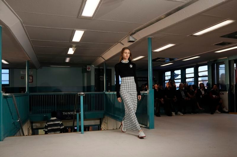 A model walks the runway during the Tommy Hilfiger Spring/Summer 2025 fashion show onboard a Staten Island Ferry as part of New York Fashion Week on Sunday, Sept. 8, 2024, in New York. (Photo by Charles Sykes/Invision/AP)