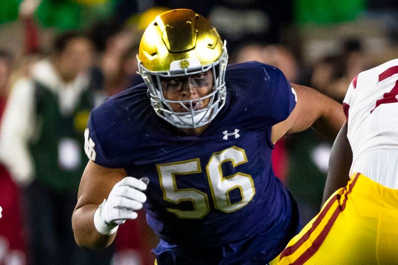 FILE - Notre Dame defensive lineman Howard Cross III (56) rushes during the first half of an NCAA college football game against Southern California, Oct. 14, 2023, in South Bend, Ind. (AP Photo/Michael Caterina, File)