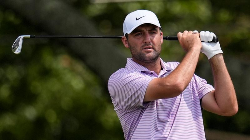 Scottie Scheffler hits from the third tee during the first round of the Tour Championship golf tournament, Thursday, Aug. 29, 2024, in Atlanta. (AP Photo/Mike Stewart)