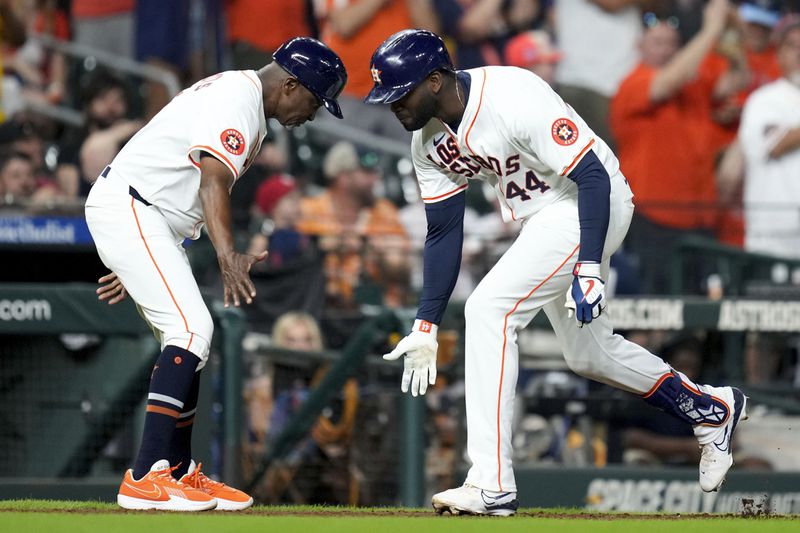 Houston Astros designated hitter Yordan Alvarez, right, celebrates his solo home run against the Los Angeles Angels with third base coach Gary Pettis during the seventh inning of a baseball game, Saturday, Sept. 21, 2024, in Houston. (AP Photo/Eric Christian Smith)